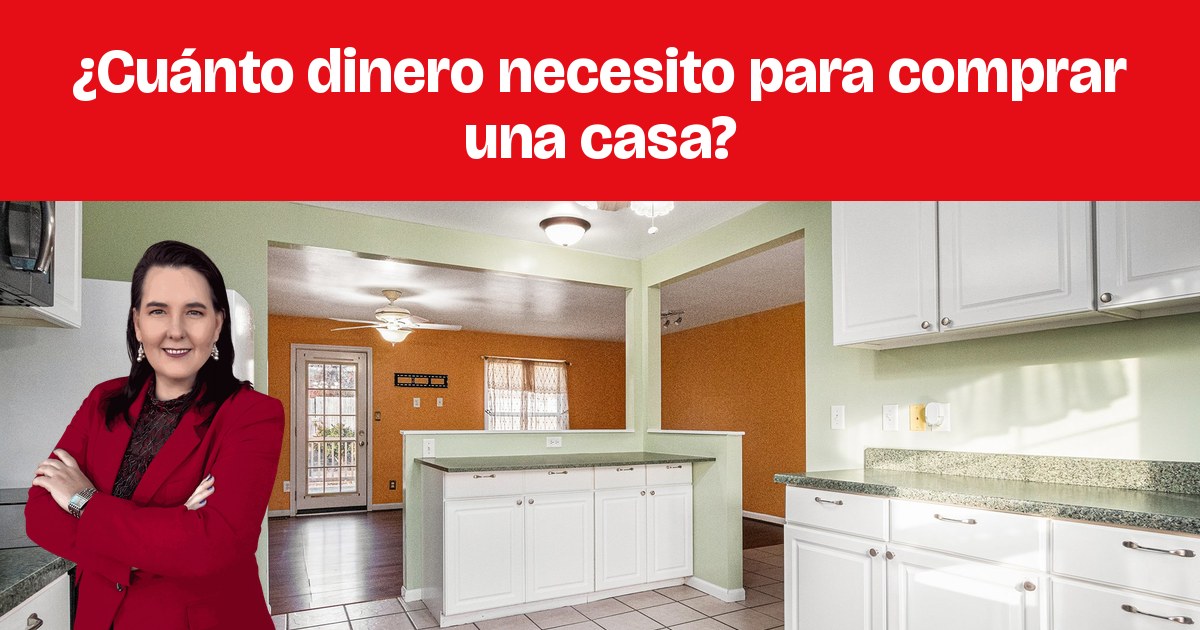 Una cocina con gabinetes blancos, piso de azulejo y una isla central.