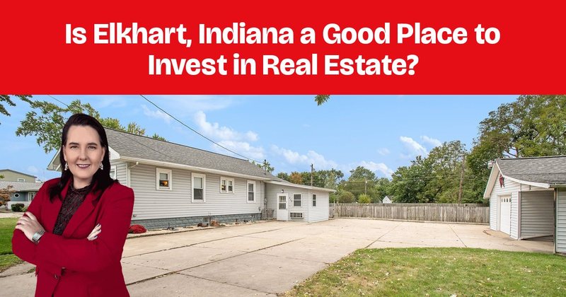 A single-story ranch home with a long driveway and a fenced yard.