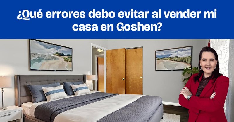 Una recámara amueblada con una cama tapizada en gris y cuadros en la pared.