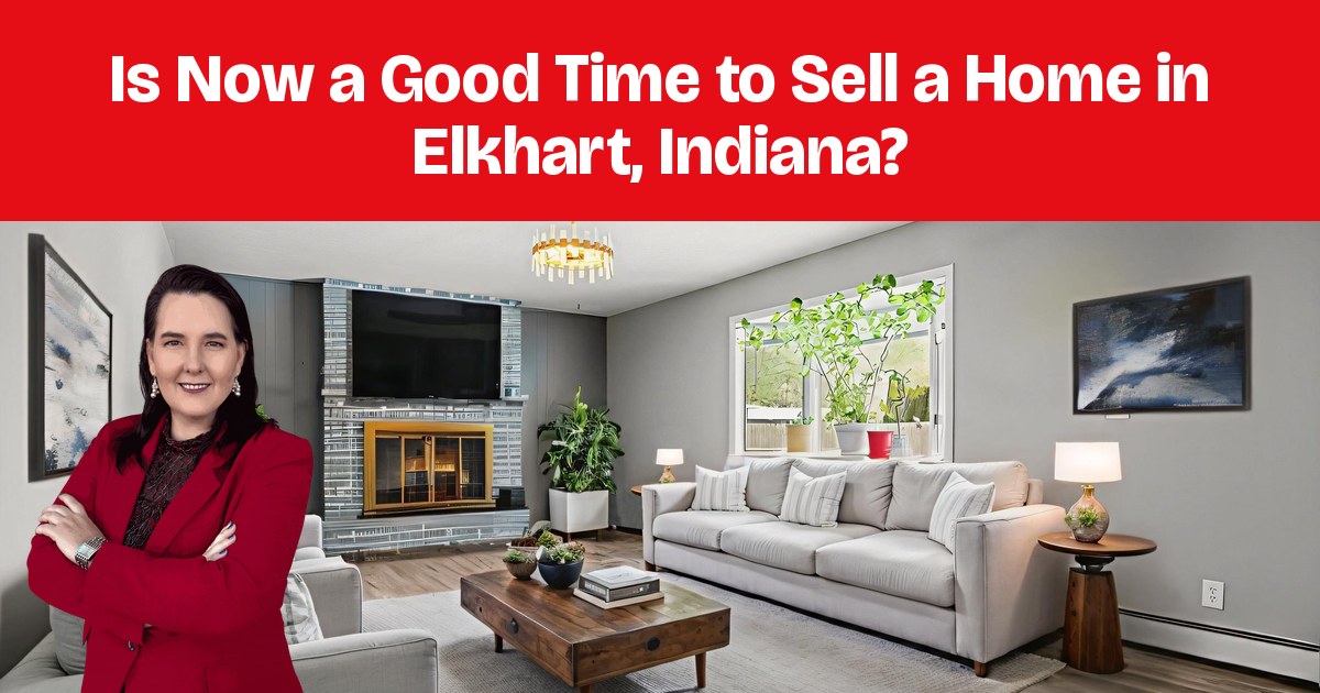A staged living room with gray sofas, a brick fireplace, and a patterned rug.
