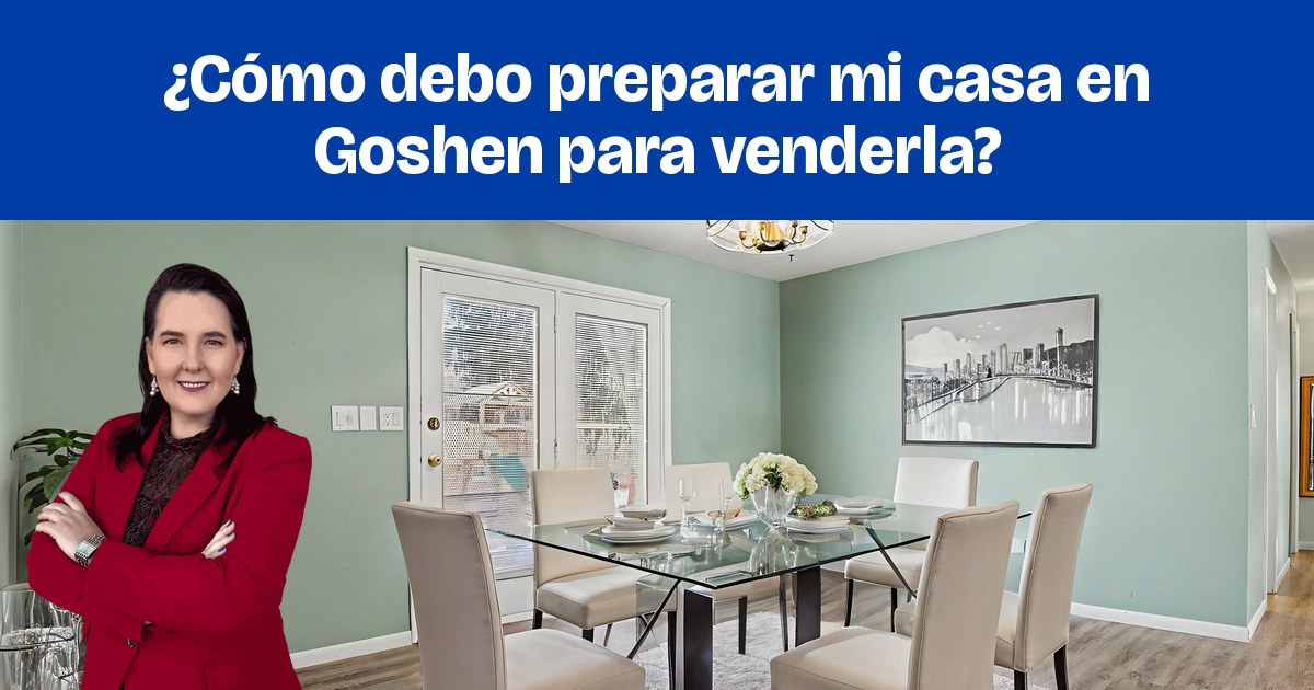Un comedor amueblado con paredes verde salvia y una mesa con cubierta de vidrio.