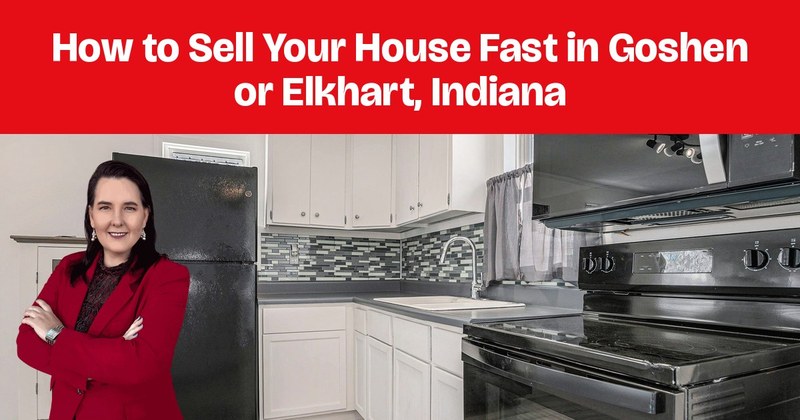 An updated kitchen with white cabinets, black appliances, and a blue-gray mosaic tile backsplash.