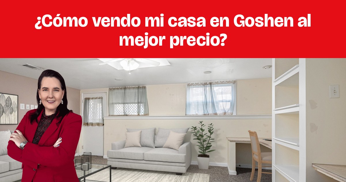 Una sala amueblada con sofás grises, una mesa de vidrio y estantes empotrados.