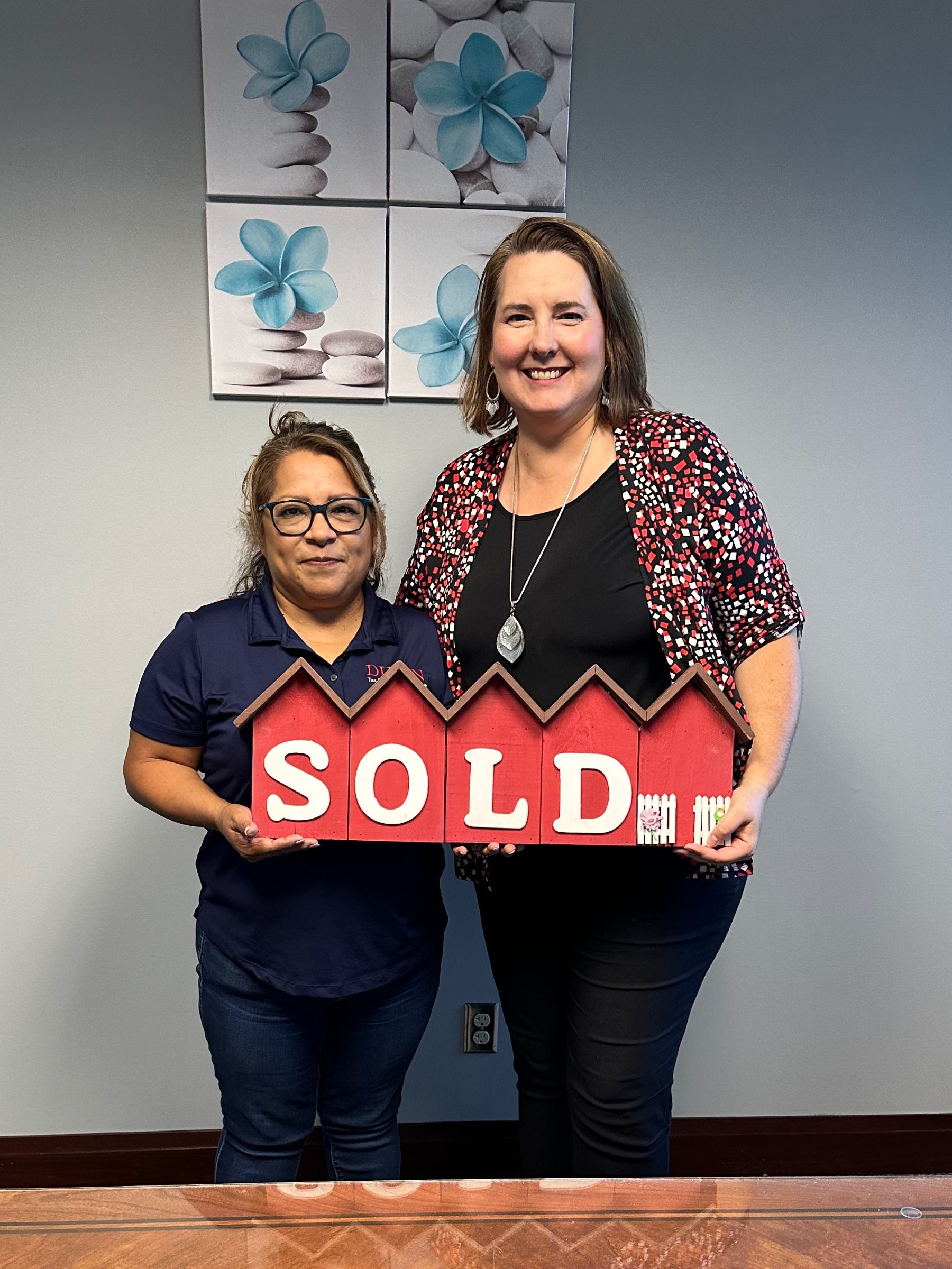 Clients of Lisa Collio celebrating a home purchase in Goshen and Elkhart, Indiana
