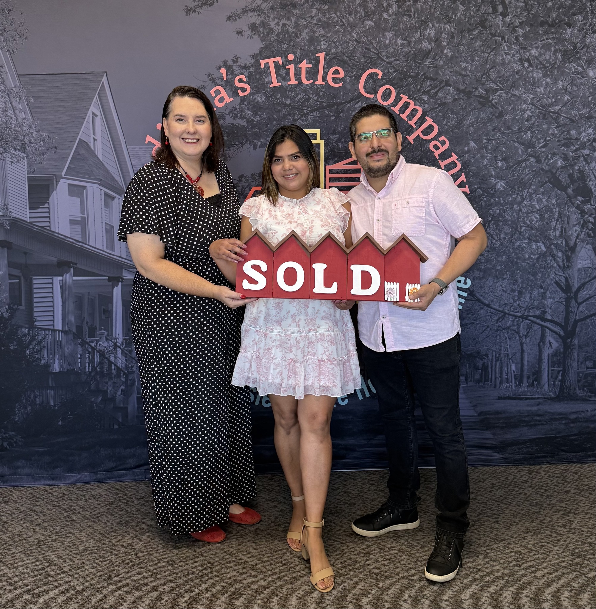 Clients of Lisa Collio celebrating a home purchase in Goshen and Elkhart, Indiana