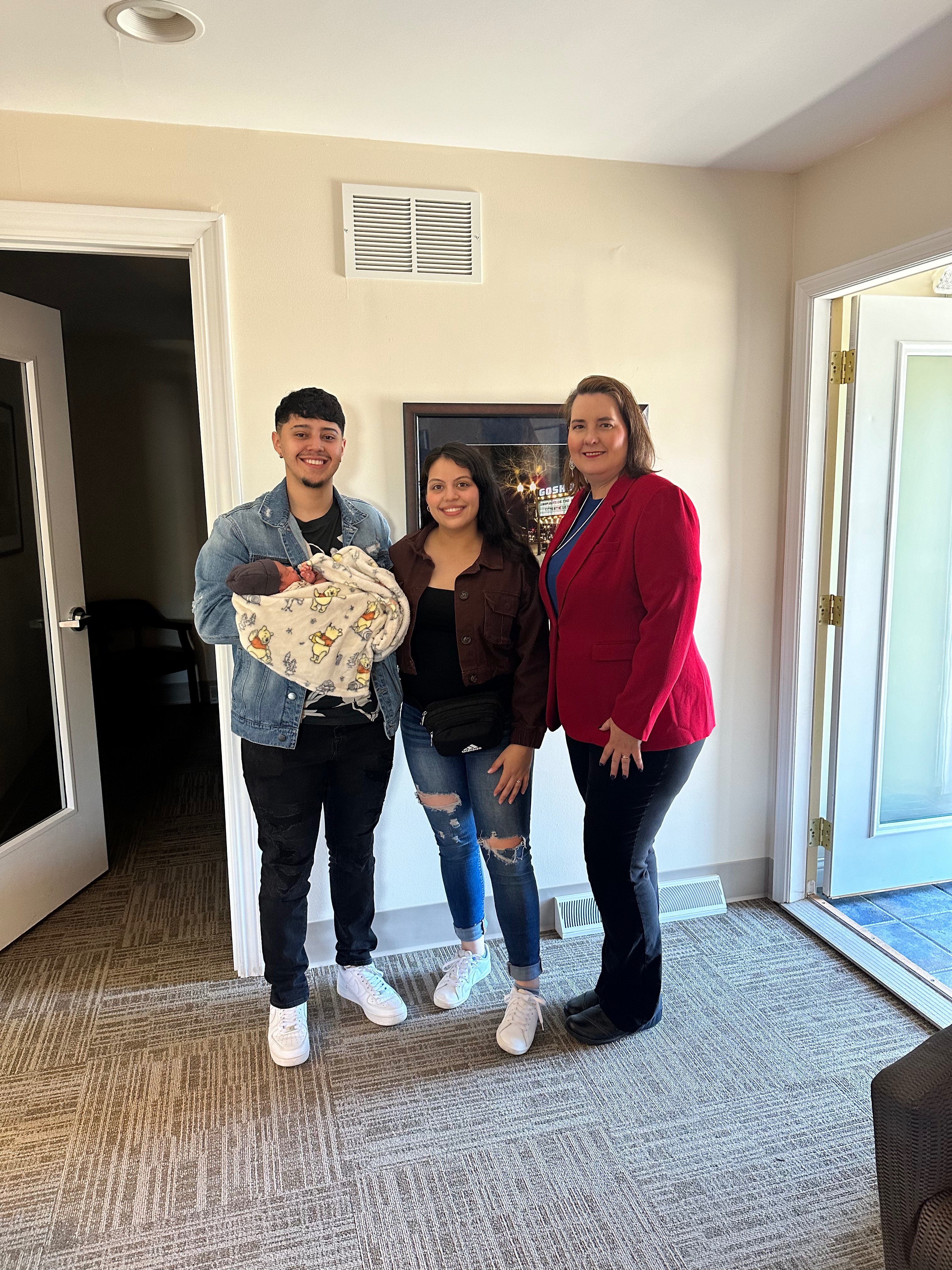 Clients of Lisa Collio celebrating a home purchase in Goshen and Elkhart, Indiana