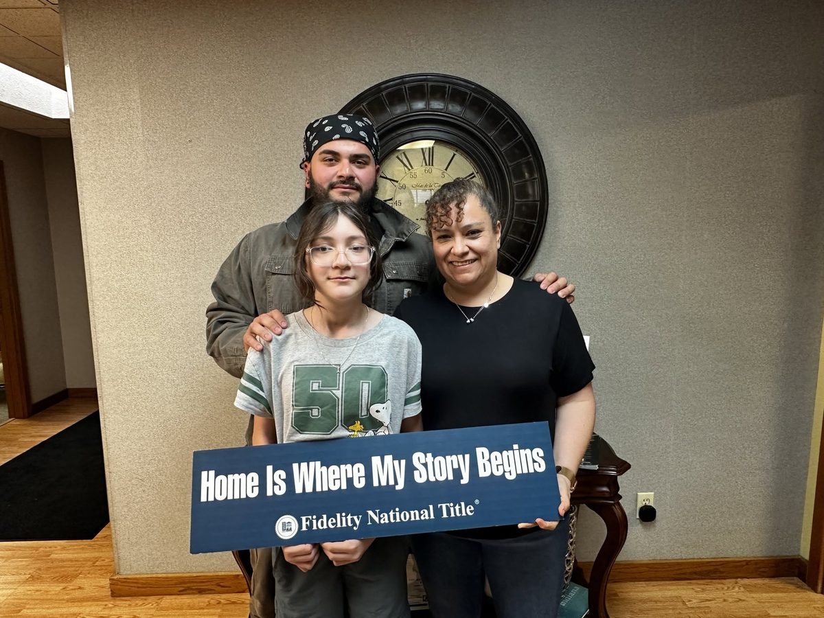 Clients of Lisa Collio celebrating a home purchase in Goshen and Elkhart, Indiana