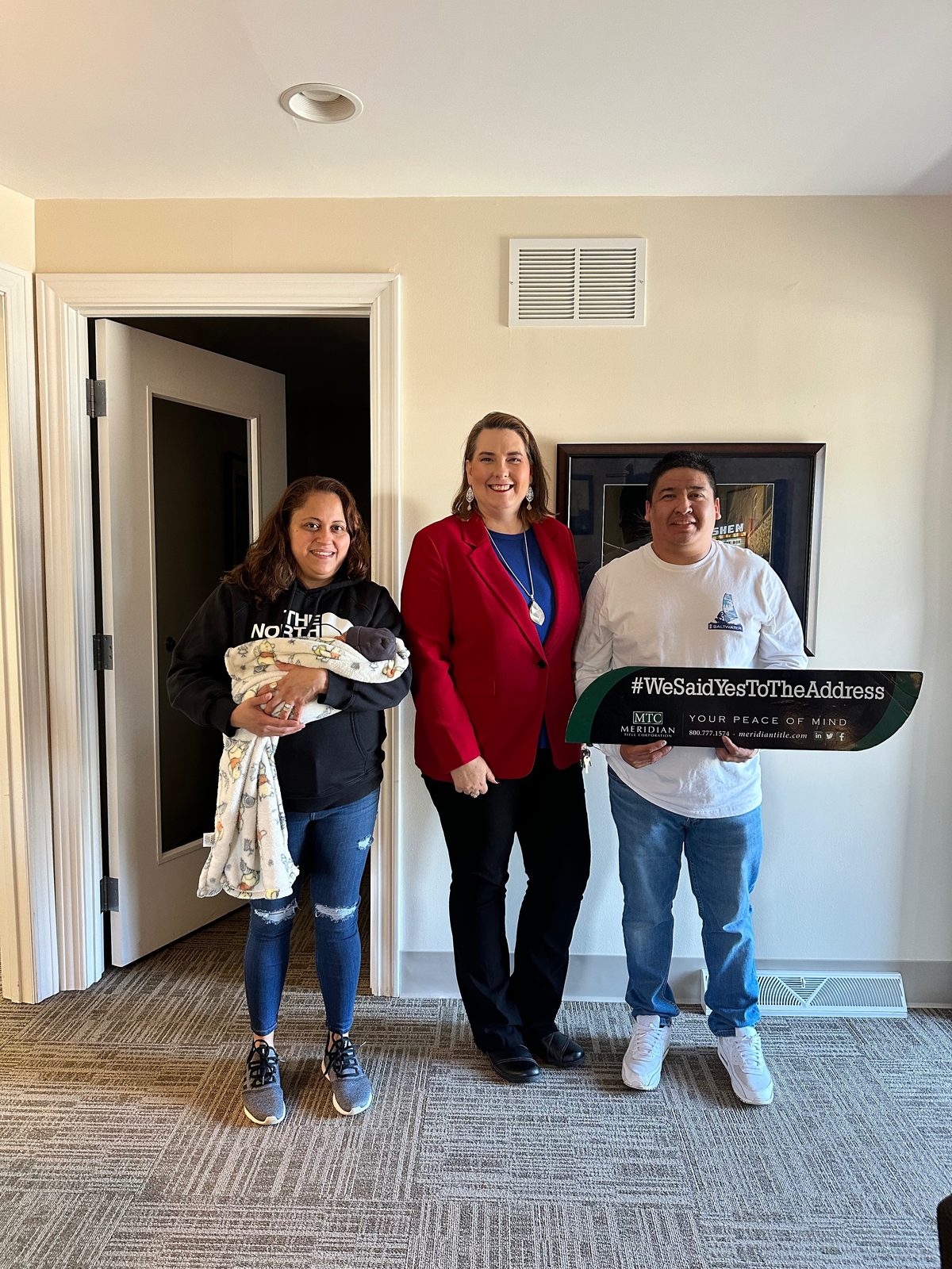 Clients of Lisa Collio celebrating a home purchase in Goshen and Elkhart, Indiana