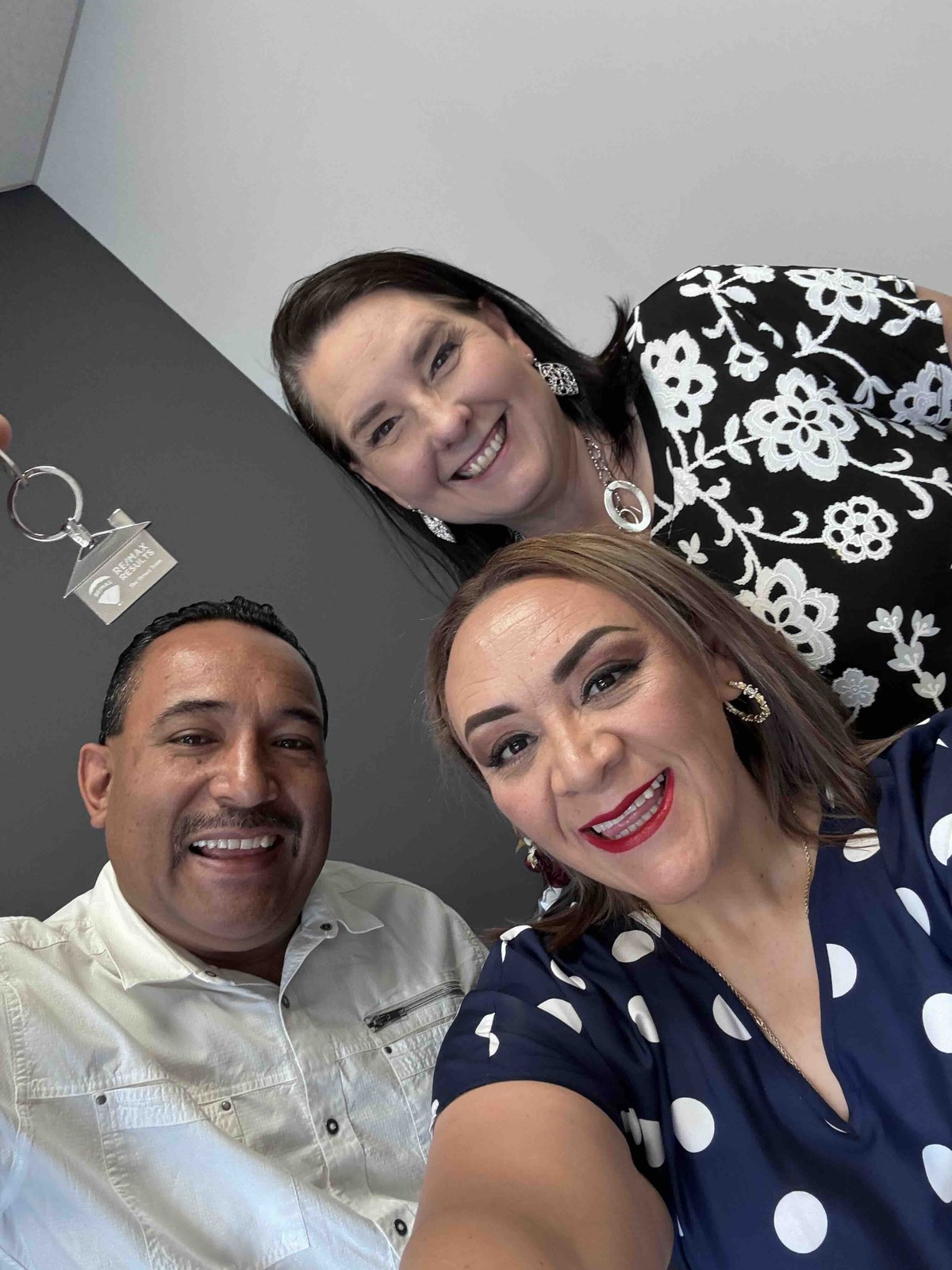 Lisa Collio with two clients after a closing.