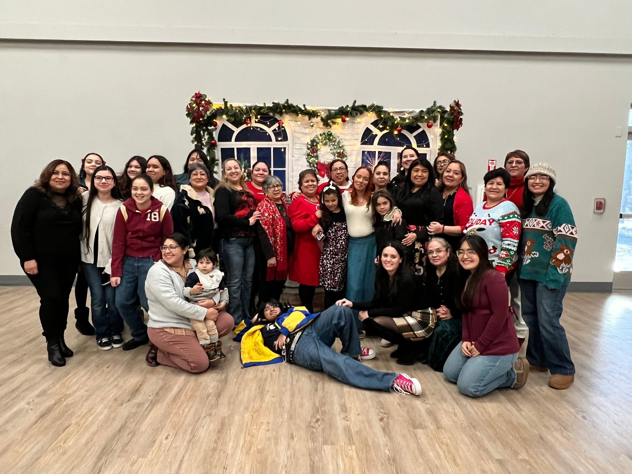 Lisa Collio with a group of women at a holiday gathering.
