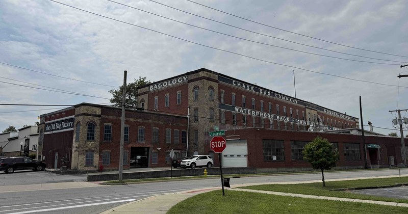 The Old Bag Factory in Goshen, Indiana, a restored brick industrial building with painted signage on its upper walls.
